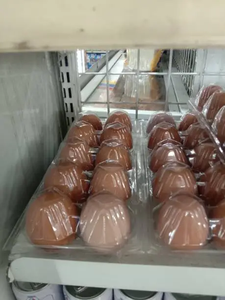 a pile of chicken eggs wrapped in a plastic hood in a mini market. Chicken eggs are good for the body because they contain high protein.