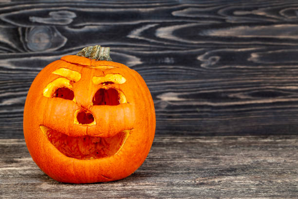 istock preparing an orange pumpkin for Halloween celebration 1388919923
