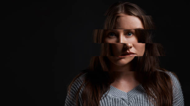 istock Studio shot of a woman posing against a dark background with a distorted face 1388920988
