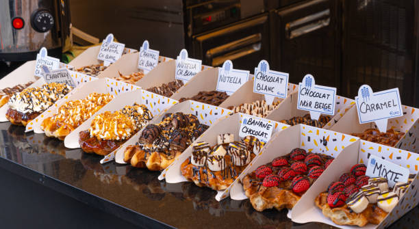 Belgian waffles with colorful toppings on showcase. Brussels stock photo