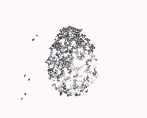 istock Easter egg made with silver glittering stars on light gray background 1388922585