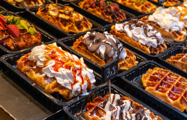istock Belgian waffles with colorful toppings on showcase. Brussels 1388923210
