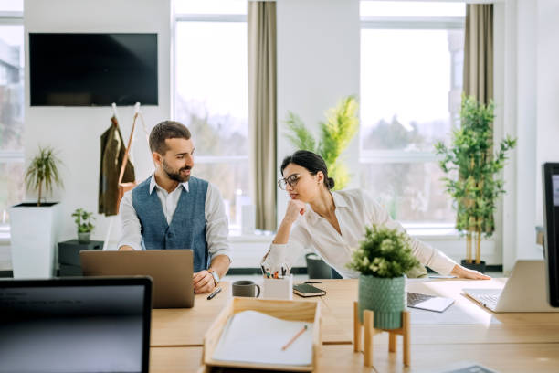istock Businesspeople working in the office together 1388923499