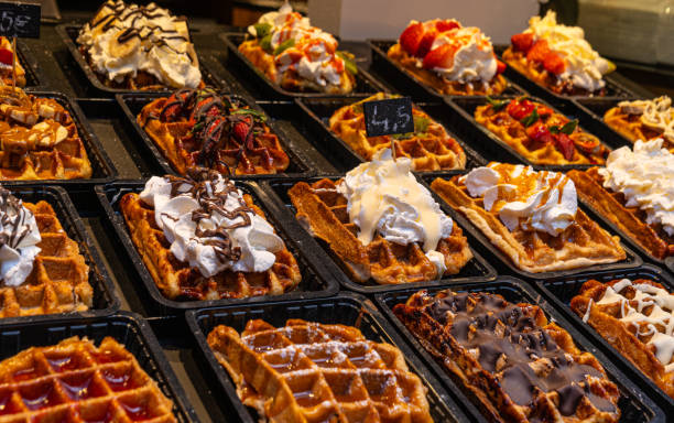 istock Belgian waffles with colorful toppings on showcase. Brussels 1388923542