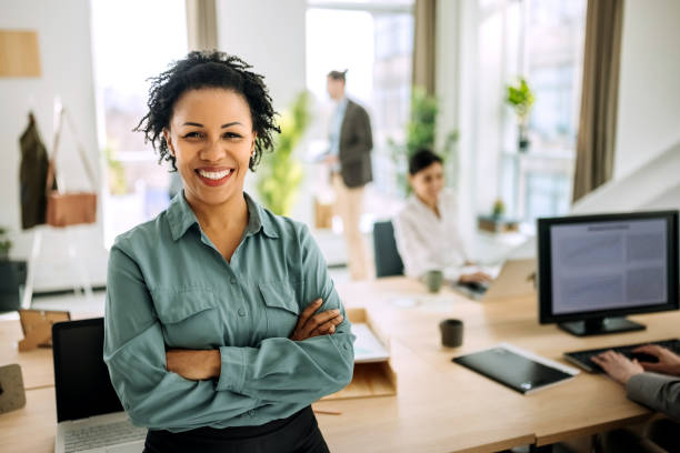 istock Smiling businesswoman posing in office 1388924510