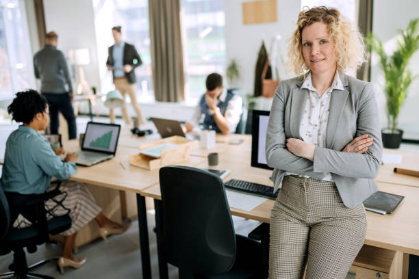 istock Well dressed businesswoman posing in office 1388924536
