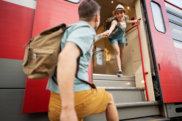 istock Girlfriend holding hands with her boyfriend while her train leaving 1388924828