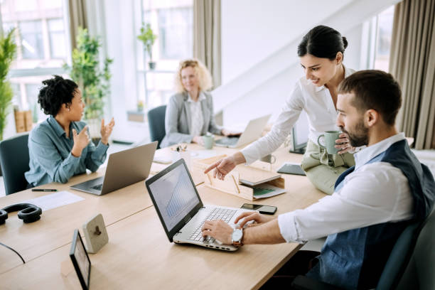 istock Colleagues discussing ideas over new project in the office 1388924840