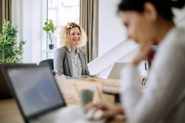 istock Smiling businesswoman working at the office 1388925072