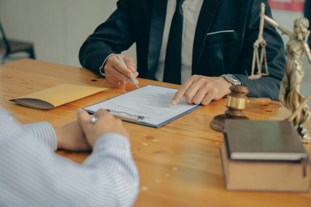 istock The client is explaining the offense to a lawyer and working together to resolve the offense. Concepts of litigation and justice in the Office of Legal Counsel to punish defendants in the courtroom. 1388925257