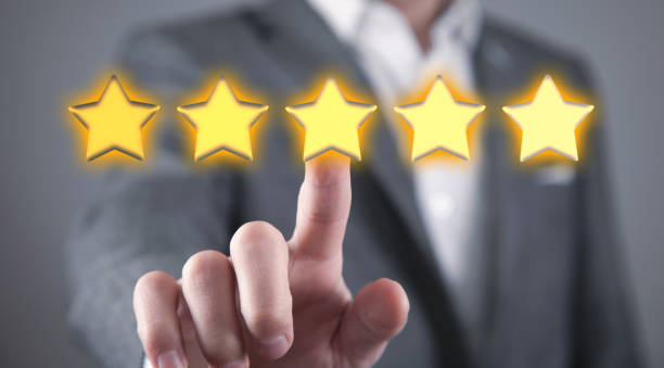 istock Male hand touching five star rating. 1388927195