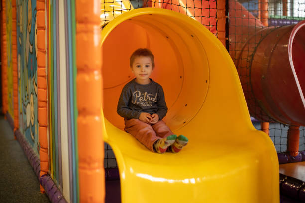 istock Child Plays in Play Center 1388927235