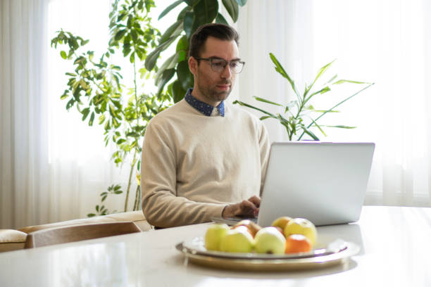 istock A dedicated man works from home 1388928416