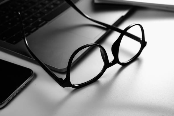 istock Mobile phone, laptop, eyes and mobile phone on white background board 1388931875