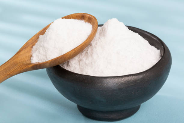 istock Bowl With Baking Soda; Photo Blue Background 1388932720