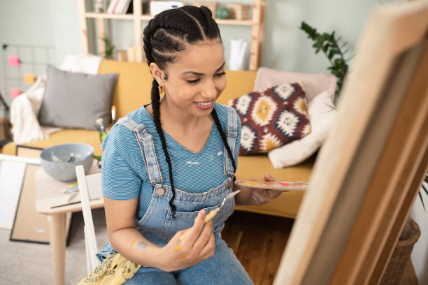istock Beautiful painter working at her living room 1388932728
