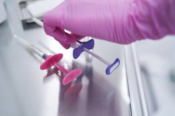 istock Close up of hand in gloves taking prick 1388934824