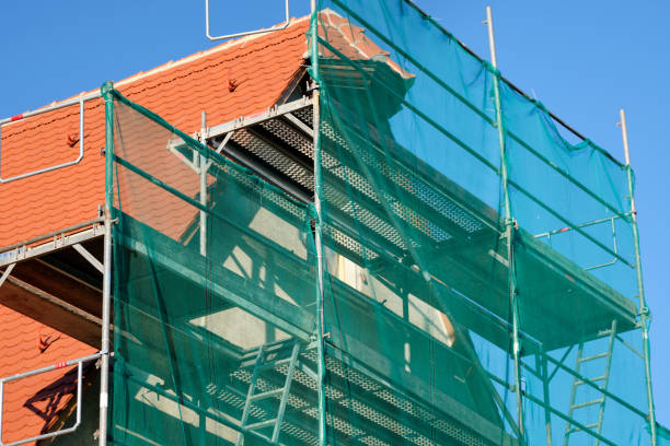 Close-up of  scaffolded facade of a historic barn building stock photo