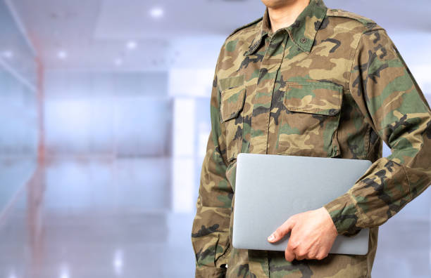 istock oldier with laptop at military school 1388935974