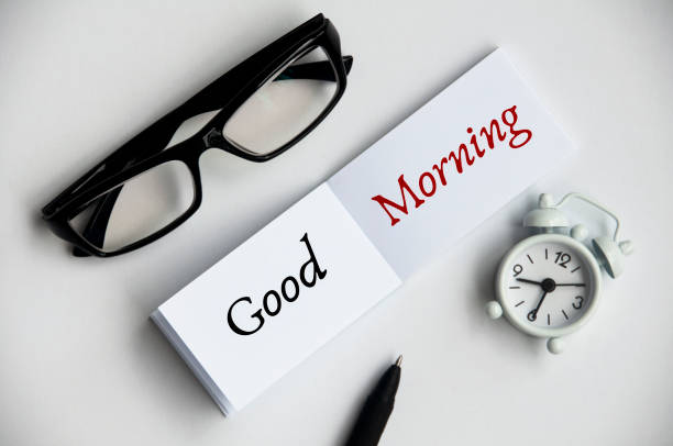 istock Good morning text on notepad with pen and Glasses. Morning greeting 1388936182