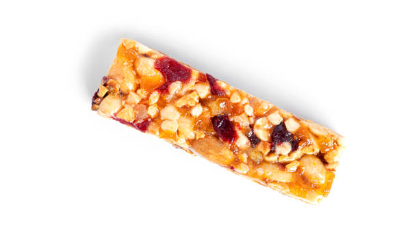 istock Granola bar with nuts and dried fruits isolated on a white background 1388936419