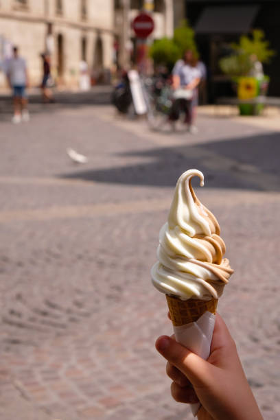 istock Coconut caramel ice cream in the child's hand. 1388936424