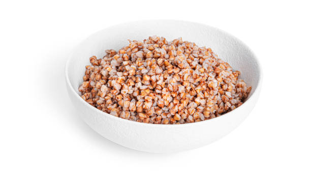 istock Buckwheat porridge in white bowl isolated on a white background 1388938084