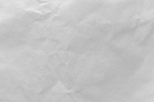 istock White color eco recycled kraft paper sheet texture cardboard background. 1388938843