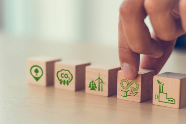 istock Circular economy concept. Business and environment sustainable. Climate changing problem solving goals.
Putting flat wooden cube with eco infinity and environment sustainable symbol on smart backgound 1388939209