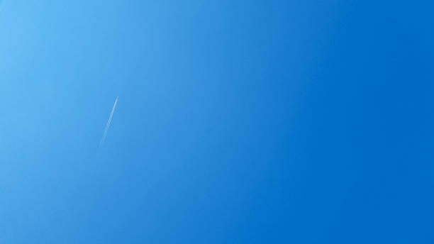 istock A plane and vapor trails in the sky 1388940168