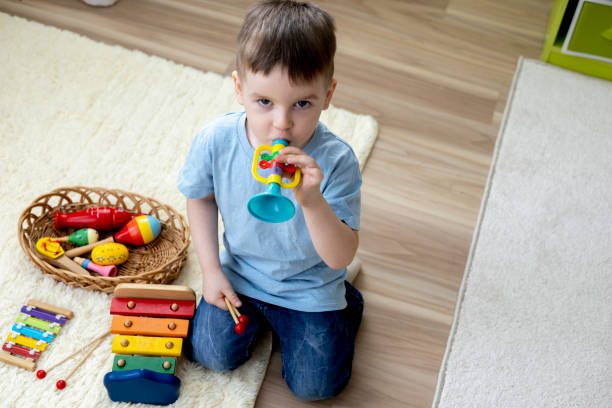 istock Montessori material. Home education. Boy are learning musical instruments. 1388941262