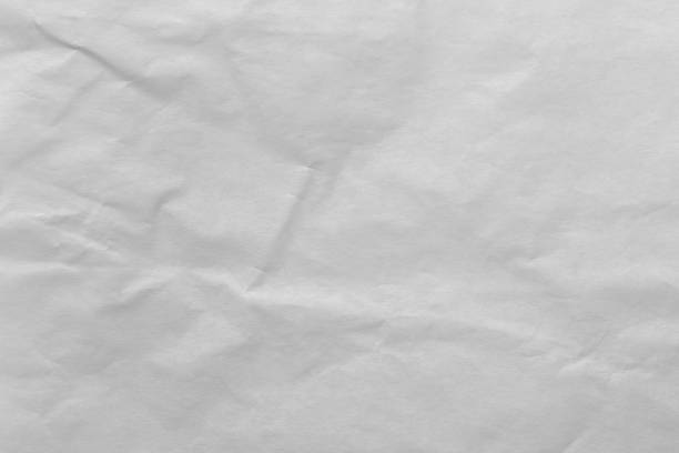istock White color eco recycled kraft paper sheet texture cardboard background. 1388941444