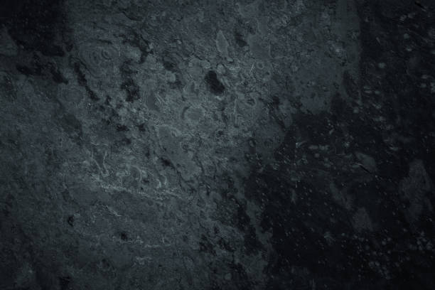 istock Dark worn grey and black slate background or texture 1388941858