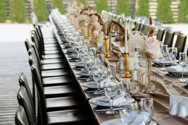 istock Arranged table with plates and glasses on a wedding reception 1388942397