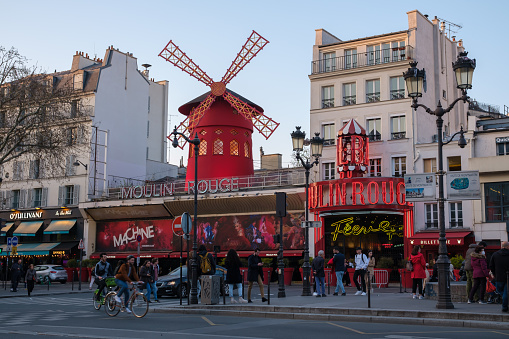 Paris, France - March 22, 2022 : The world famous Moulin Rouge cabaret in Paris France