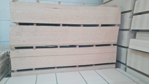 istock OSB - Oriented strand board. Stacked OSB sheets. Sheet material for the construction of frame houses 1388946633