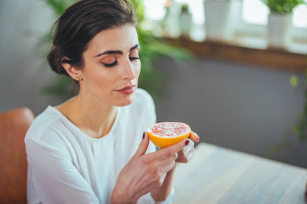 istock Sick woman trying to sense smell 1388946973