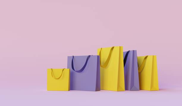 sacchetti di carta colorati su sfondo rosa. concetto di evento di shopping o vendita online. rendering 3d - borsa della spesa foto e immagini stock