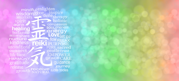 wide graduated pink blue green yellow orange red bokeh colours and a Reiki Kanji symbol surrounded by relevant words on left and copy space on right