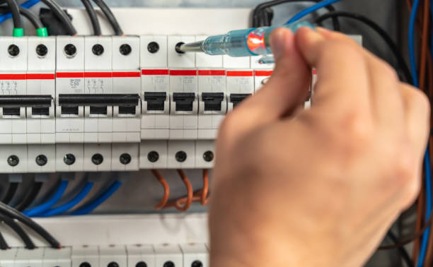 istock Electrician checking fuse box, close-up 1388949527