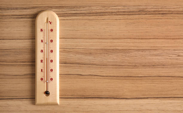 istock Weather thermometer on wooden table, top view. Space for text 1388949871