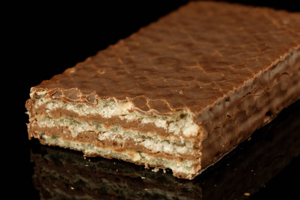 istock Waffle candies in chocolate black background 1388950149