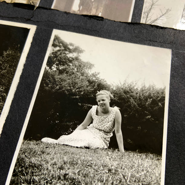 istock Young Woman Sitting on Grass 1936 black and white 1388951135