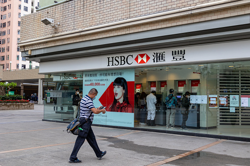 Hong Kong - April 1, 2022 : People at the HSBC Hongkong and Shanghai Bank branch in Kowloon Bay, Hong Kong.