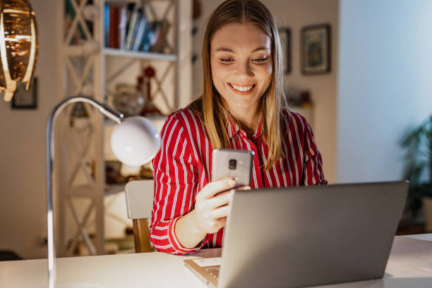 istock Young woman scrolling through social media while taking a break from work 1388953787