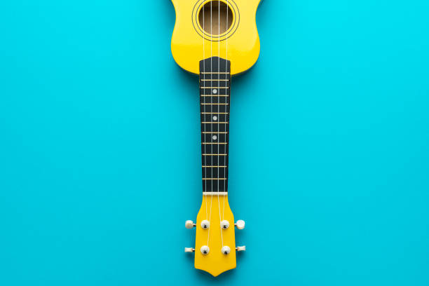 istock Overhead photo of yellow ukulele with copy space 1388955754