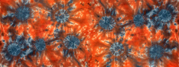 istock Abstract colorful art design batik spiral swirl shibori technology tie dye batic pattern textile fabric texture background banner, with circles in complementary colors blue orange 1388955863