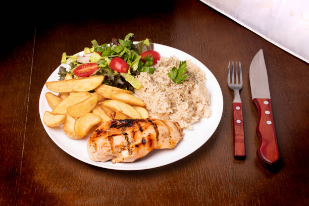 istock healthy eating with grilled chicken, brown rice and angle view salad 1388955929