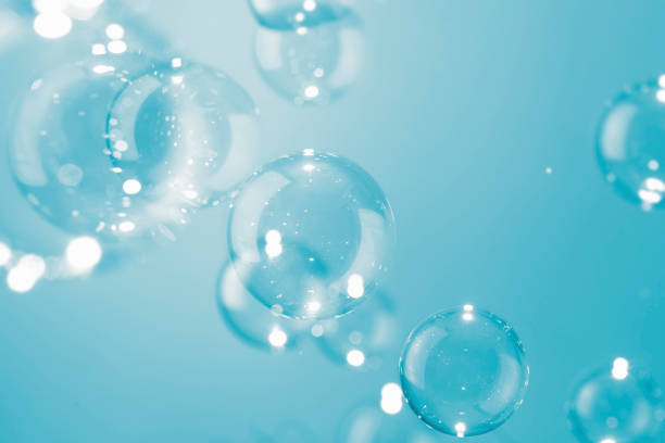 istock Transparent Blue Soap Bubbles Background. Soap Suds Bubbles Water 1388955990