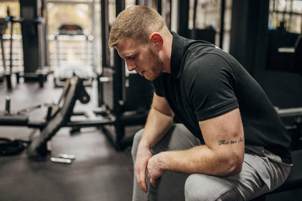 istock Man sitting in gym 1388957754